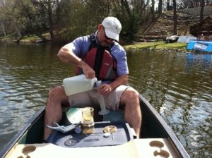 A local resident collecting a water sample for CAMP