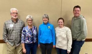 Five board managers pose for a picture