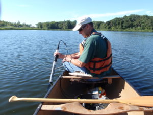 Barr Engineering staff monitoring a lake