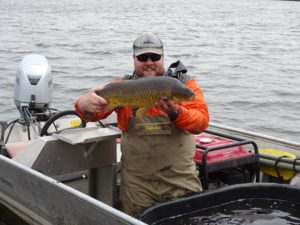 Man holding a carp
