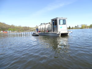 Image of Barge applying alum to a lake