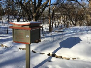 Little seed library in snow.