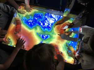 Kids explore landforms and watersheds using the new watershed sandbox
