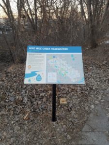 Sign describes headwaters of 9 Mile Creek