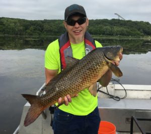 Image of a man holding a carp