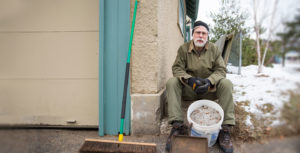 Joe Knaeble with bucket of sidewalk salt for reuse