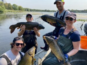 Photo of people holding carp