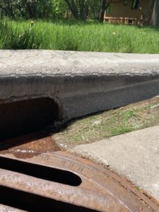 image of grass clippings entering storm drain