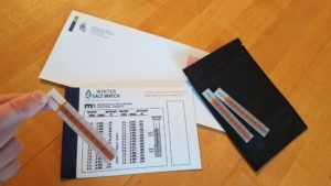 Envelope with kit materials including chloride test strips